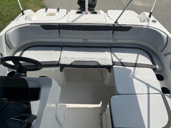 Slide: The Image of 2024 Bayliner Element M17 boat interior with cushioned seating and steering console. - 13