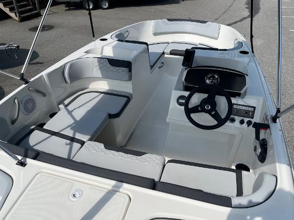 Slide: The Image of 2024 Bayliner Element M17 boat interior with seating and steering console. - 6