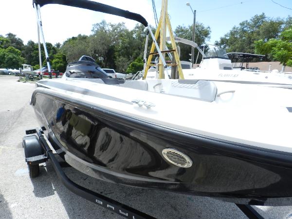 Slide: The Image of 2025 Bayliner M15 boat on trailer, sleek black design, outdoor setting. - 1