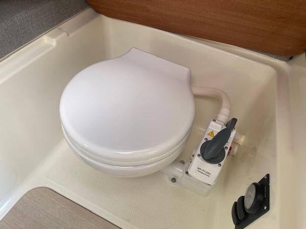 Slide: The Image of Bayliner Trophy 23 Pilothouse 2024 marine toilet in cabin. - 22