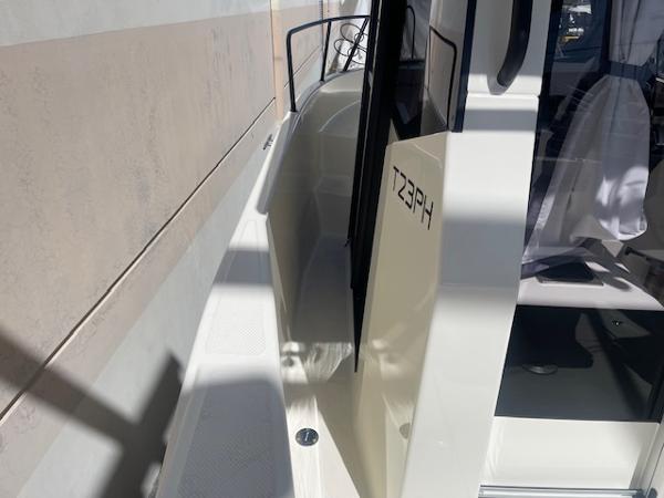 Slide: The Image of 2024 Bayliner Trophy 23 Pilothouse side deck and cabin entrance. - 23