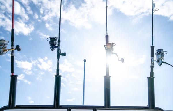 Slide: The Image of Fishing rods on a 2024 Bayliner Trophy 23 Pilothouse boat against a sunny sky. - 26