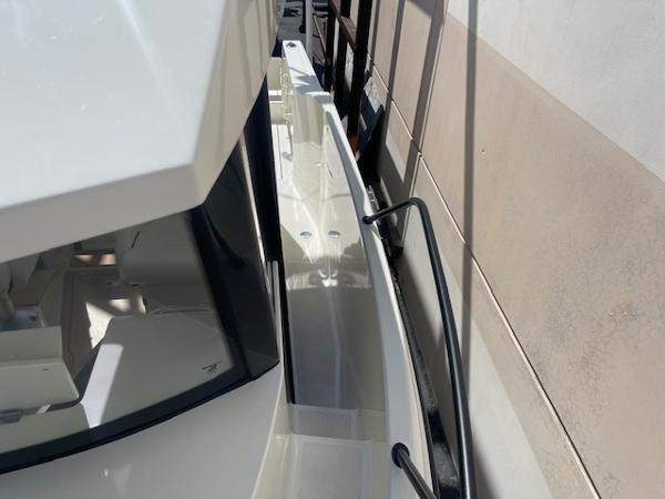 Slide: The Image of 2024 Bayliner Trophy 23 Pilothouse side deck and cabin view. - 3