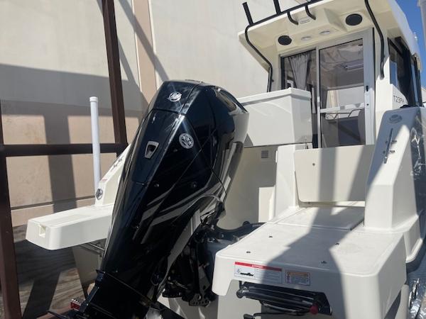 Slide: The Image of 2024 Bayliner Trophy 23 Pilothouse boat with outboard motor. - 5