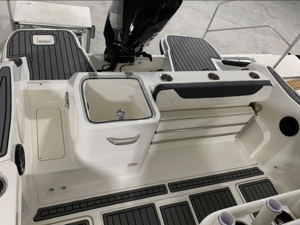 Slide: The Image of 2024 Bayliner Trophy 24 CC boat interior with seating and storage. - 14