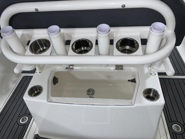 Slide: The Image of Bayliner Trophy 24 CC 2024 fishing rod holders and storage compartment. - 8