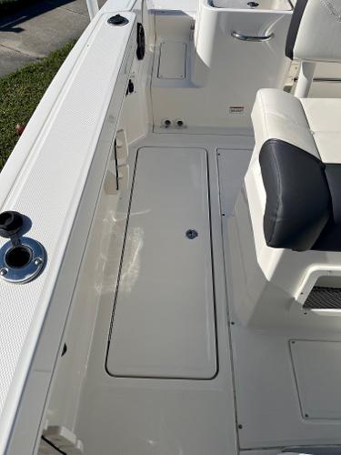 Slide: The Image of 2023 Bayliner Trophy T24 boat interior with seating and storage compartments. - 12