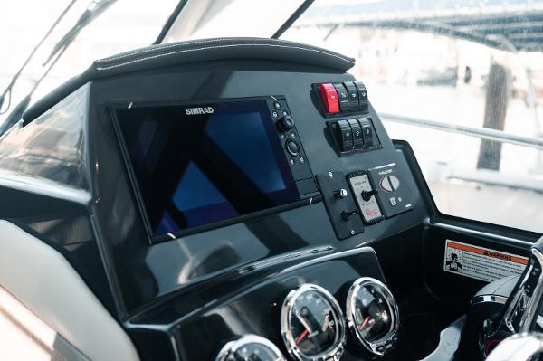 Slide: The Image of 2024 Bayliner Trophy T29EX dashboard with Simrad display and control panel. - 4