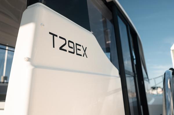 Slide: The Image of 2024 Bayliner Trophy T29EX boat exterior with model name visible. - 8
