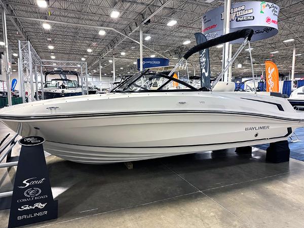 Slide: The Image of 2024 Bayliner VR5 boat displayed at an indoor boat show. - 0