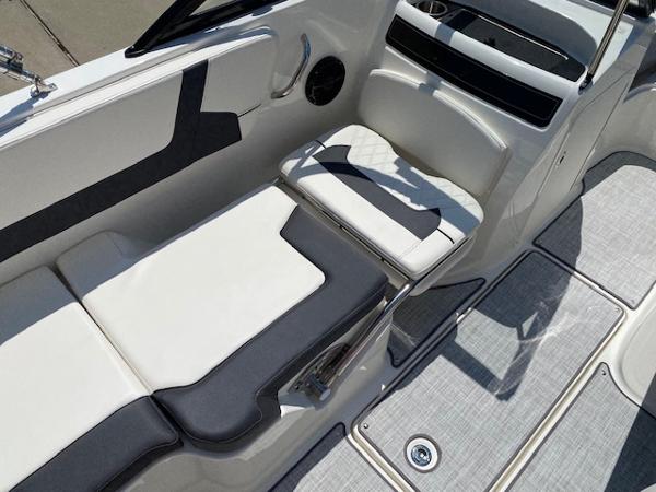 Slide: The Image of 2024 Bayliner VR5 boat interior with white and gray seating and modern design. - 16
