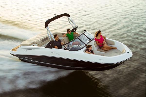 Slide: The Image of 2023 Bayliner VR5 Bowrider cruising on water with passengers. - 1