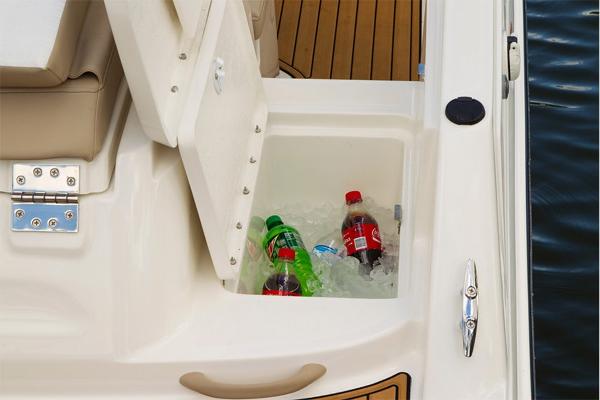 Slide: The Image of Built-in cooler with drinks on a 2023 Bayliner VR5 Bowrider boat. - 14