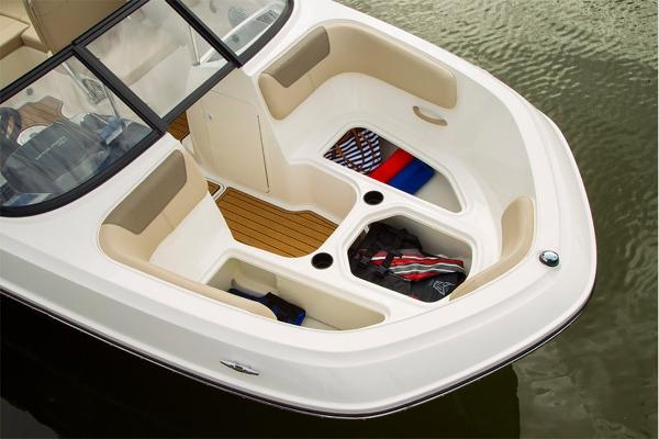 Slide: The Image of 2023 Bayliner VR5 Bowrider boat interior with storage compartments and seating. - 16