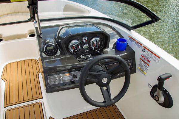 Slide: The Image of 2023 Bayliner VR5 Bowrider dashboard with steering wheel and control panel. - 17