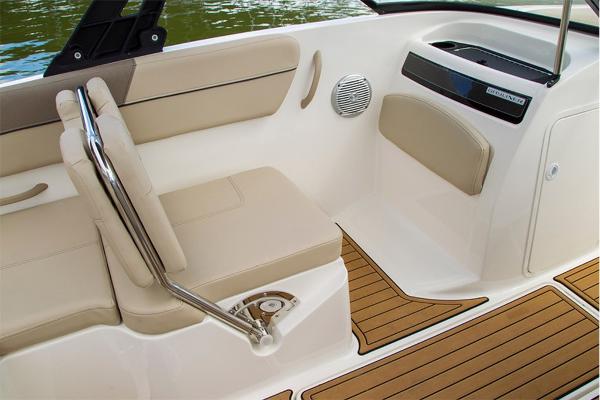 Slide: The Image of 2023 Bayliner VR5 Bowrider interior with beige seating and teak flooring. - 19