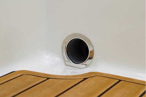 Slide: The Image of 2023 Bayliner VR5 Bowrider drain plug and teak flooring detail. - 20
