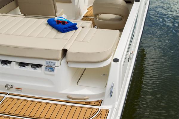 Slide: The Image of 2023 Bayliner VR5 Bowrider boat interior with beige seating and wooden deck. - 24