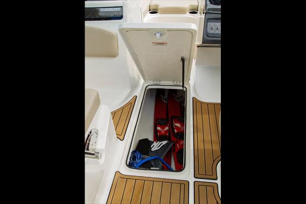Slide: The Image of 2023 Bayliner VR5 Bowrider storage compartment with water sports equipment. - 25