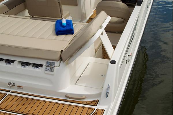 Slide: The Image of 2023 Bayliner VR5 Bowrider boat interior with tan seating and storage compartment. - 26