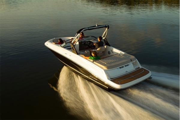 Slide: The Image of 2023 Bayliner VR5 Bowrider cruising on calm water. - 6