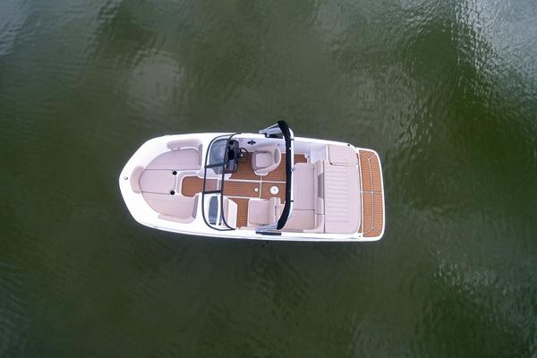 Slide: The Image of 2023 Bayliner VR5 Bowrider boat on calm water, aerial view. - 8