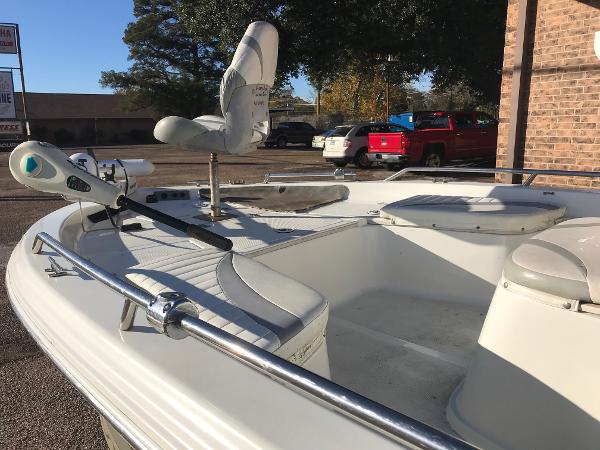 Slide: The Image of 2005 Bay Stealth 2030 Liner boat with seating and fishing equipment. - 2