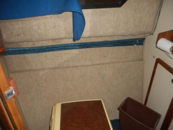Slide: The Image of Interior of a 1984 Beachcraft Cabin Cruiser with beige walls and blue accents. - 17