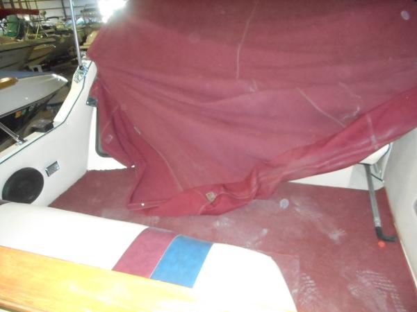 Slide: The Image of Interior of a 1984 Beachcraft Cabin Cruiser with red upholstery and seating. - 8