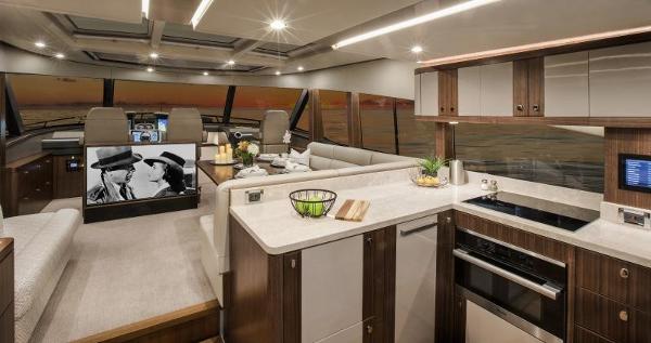 Slide: The Image of Luxurious interior of 2024 Belize 66 Sedan yacht with modern kitchen and entertainment area. - 11