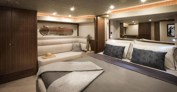 Slide: The Image of Luxurious master bedroom in the 2024 Belize 66 Sedan yacht. - 14