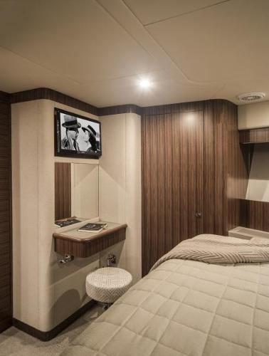 Slide: The Image of Luxurious interior of 2024 Belize 66 Sedan yacht with cozy bedroom and TV. - 19