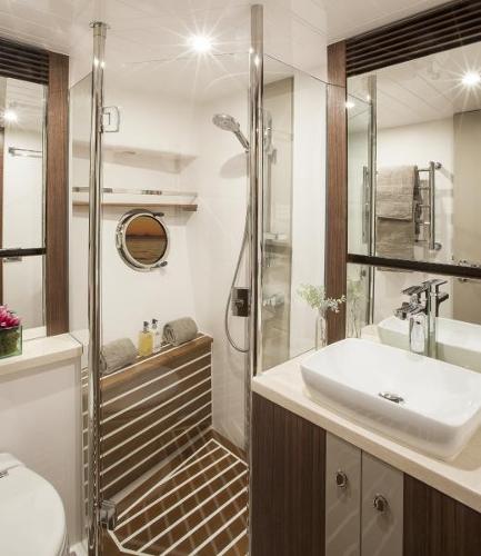 Slide: The Image of Luxurious bathroom in 2024 Belize 66 Sedan yacht with modern fixtures and glass shower. - 20