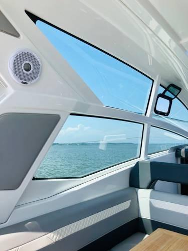Slide: The Image of Interior view of 2024 Beneteau 36 Gran Turismo GT yacht with ocean backdrop. - 16