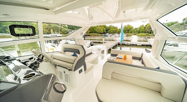 Slide: The Image of Interior of 2024 Beneteau 36 Gran Turismo GT yacht with luxurious seating and panoramic windows. - 19