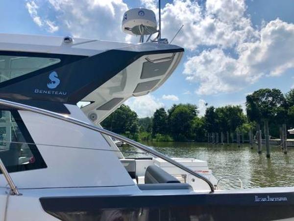 Slide: The Image of 2024 Beneteau 36 Gran Turismo GT yacht docked by a scenic river. - 21