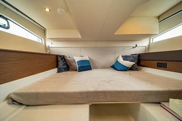 Slide: The Image of 2024 Beneteau 36 Gran Turismo GT cabin with cozy bed and pillows. - 27