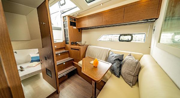 Slide: The Image of Interior of 2024 Beneteau 36 Gran Turismo GT yacht with cozy seating area. - 30