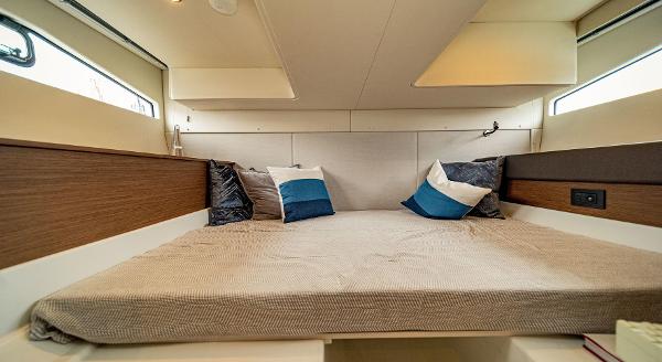Slide: The Image of 2024 Beneteau 36 Gran Turismo GT cabin with cozy bed and pillows. - 33