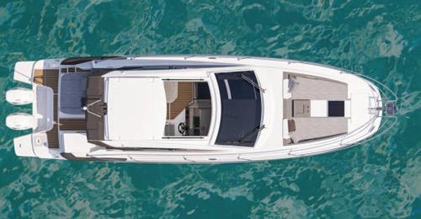Slide: The Image of Top view of 2024 Beneteau 36 Gran Turismo GT yacht on clear blue water. - 9
