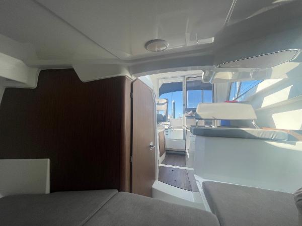 Slide: The Image of Interior of 2022 Beneteau Antares 7 boat, featuring modern design and comfortable seating. - 9