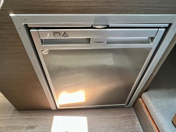 Slide: The Image of Built-in refrigerator in 2024 Beneteau Flyer 9 SUNdeck boat interior. - 10
