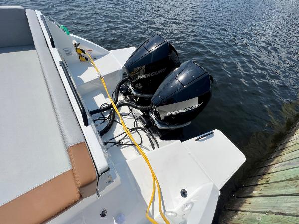 Slide: The Image of 2024 Beneteau Flyer 9 SUNdeck with twin Mercury outboard engines docked. - 20