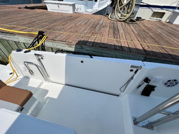 Slide: The Image of 2024 Beneteau Flyer 9 SUNdeck at dock, showing clean deck and seating area. - 21