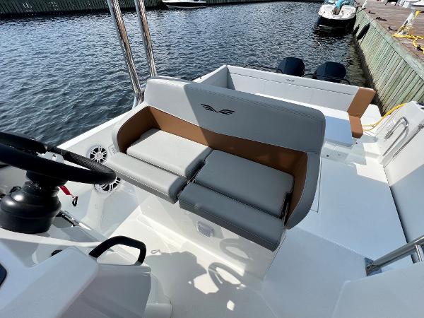 Slide: The Image of 2024 Beneteau Flyer 9 SUNdeck boat interior with seating and steering wheel. - 24