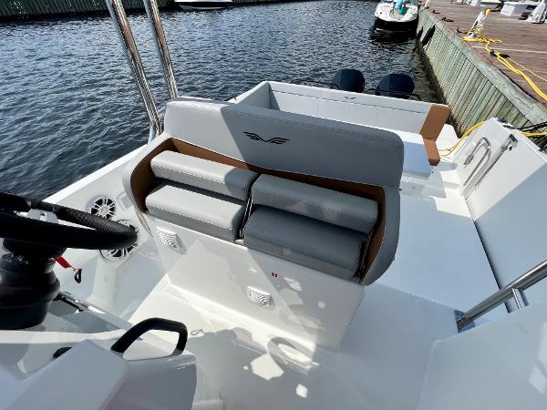 Slide: The Image of 2024 Beneteau Flyer 9 SUNdeck boat interior with seating and steering wheel. - 25