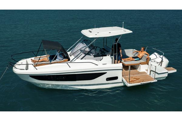 Slide: The Image of 2024 Beneteau Flyer 9 SUNdeck boat on water, featuring spacious deck and modern design. - 5