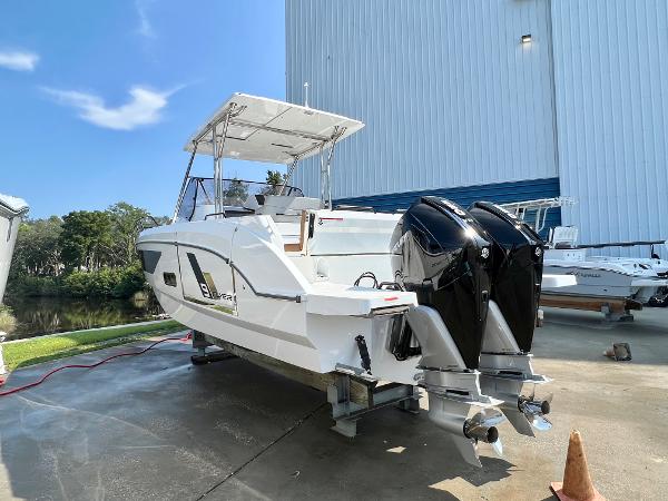 Slide: The Image of 2024 Beneteau Flyer 9 SUNdeck boat with twin outboard engines on a sunny day. - 6