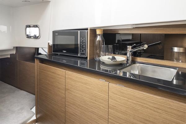 Slide: The Image of Modern kitchen interior of 2024 Beneteau Flyer 9 SUNdeck with microwave and sink. - 8