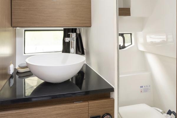 Slide: The Image of 2024 Beneteau Flyer 9 SUNdeck bathroom with modern sink and sleek design. - 9